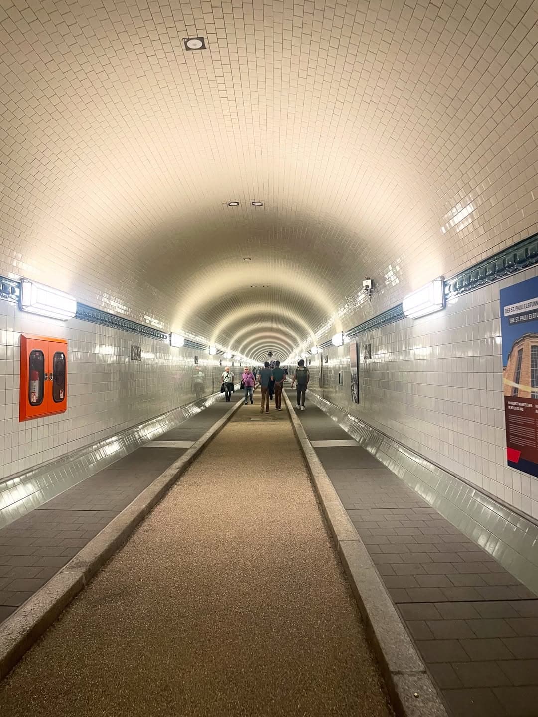Tiled pedestrian passage inside the historic Old Elbe Tunnel in Hamburg