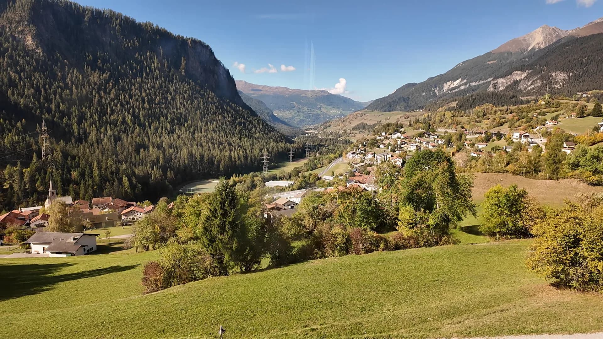 Clear mountain and valley scenery seen from the regional train on the Albula Line