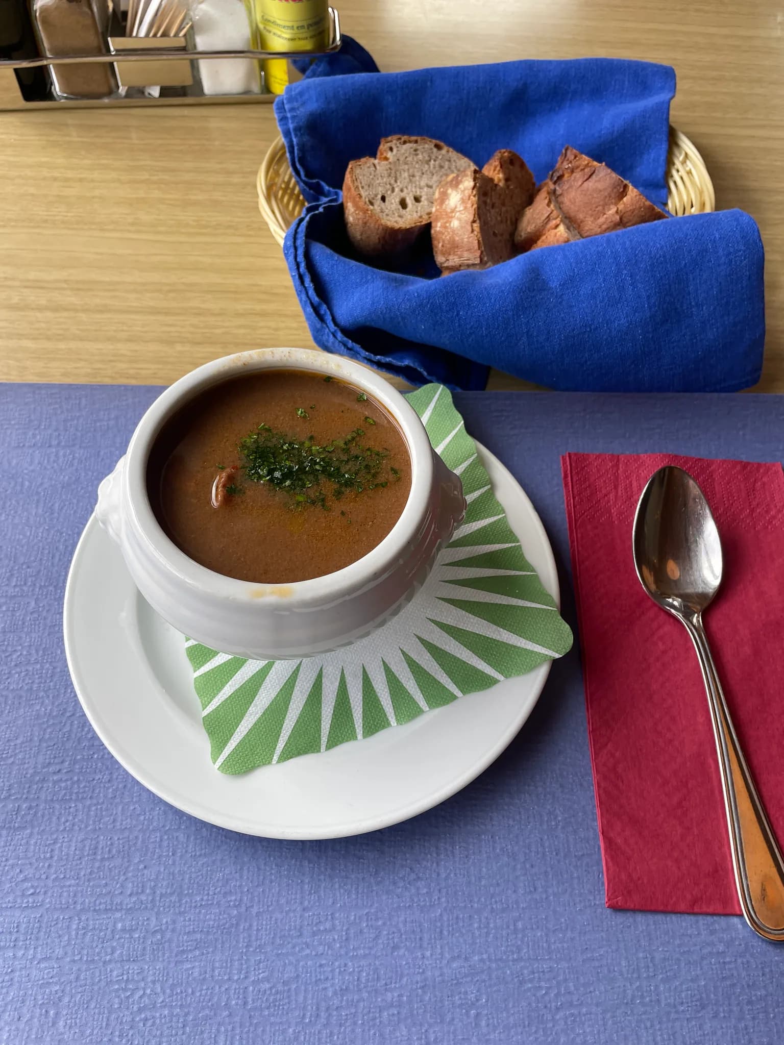 Bowl of goulash soup with bread served at Restaurant Alp Grüm