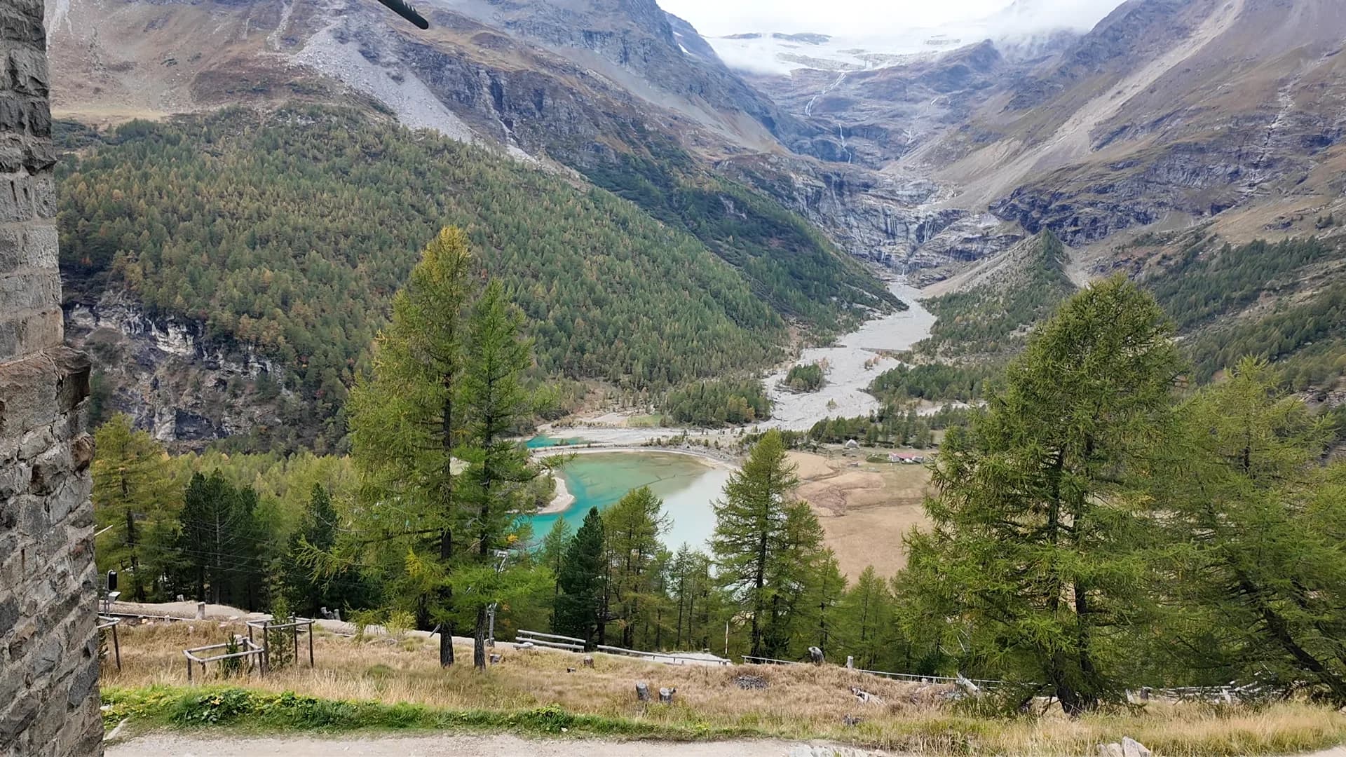 Panoramic mountain, glacier, waterfall and turquoise lake view from Alp Grüm station