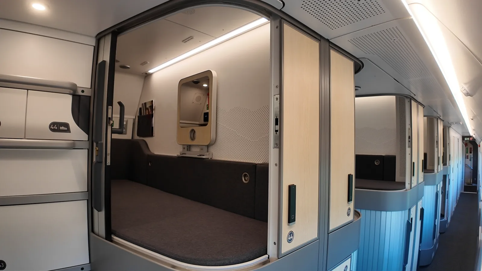 Corridor of stacked ÖBB Nightjet Mini Cabins with luggage compartments